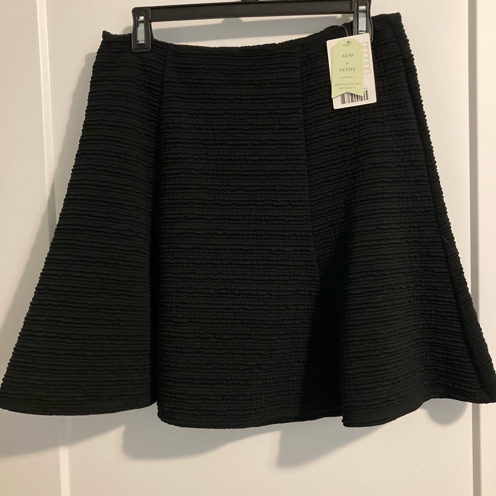 Nice black skirt 18 inches long from waist to bottom zipper on the back